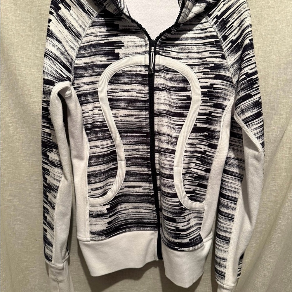 Dynamic Black and White Zip Up Jacket with Abstract Stripes